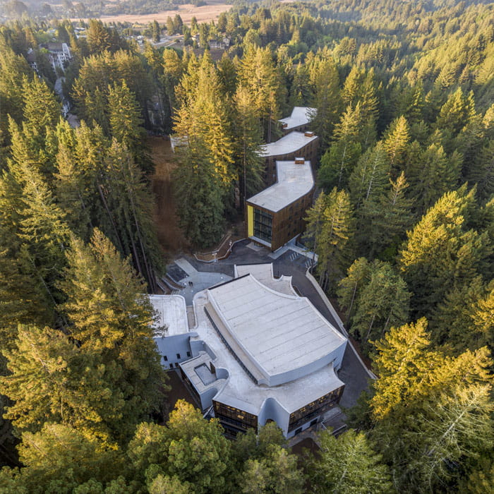 Aerial view of Kresge College surrounding by red woods.
